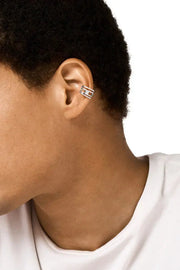 Stainless steel ear cuff features the D logo in a wrapped design Diesel